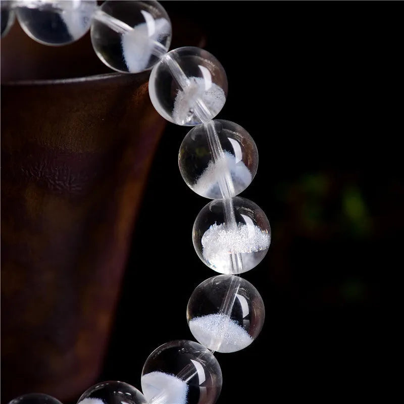 Women's white crystal pyramid bracelet with Ruyi charm in natural ghost colour showing geometric beads