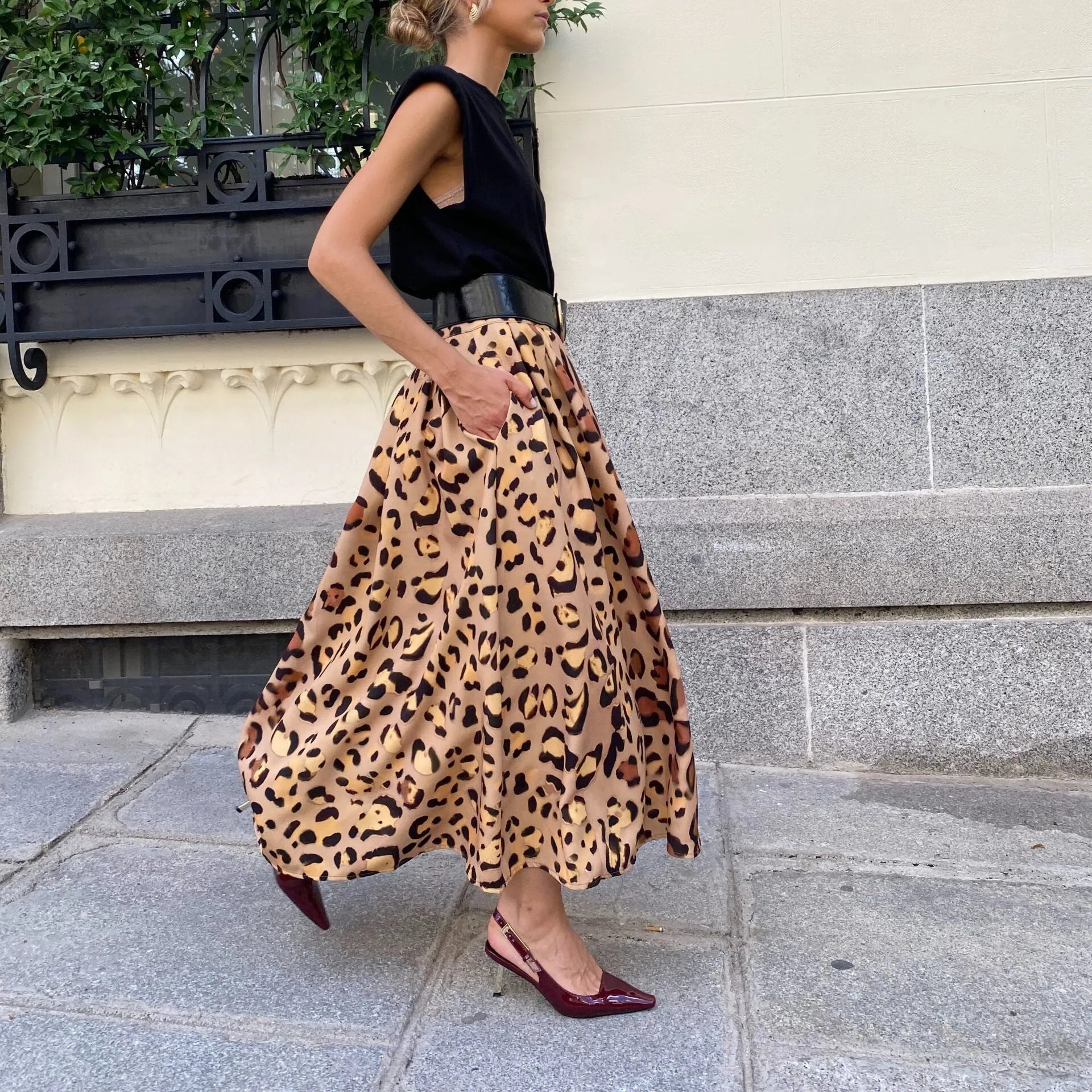 Brown leopard print women's long A-line skirt with a big hem, laid flat.