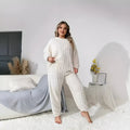 Women's milky white polyester lounge set with crew neck top and matching trousers