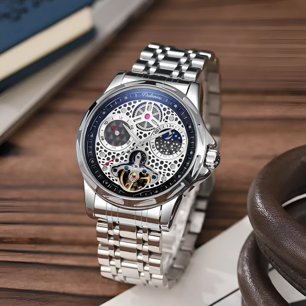 Men's automatic watch with black dial and steel bracelet showing luminous hands.