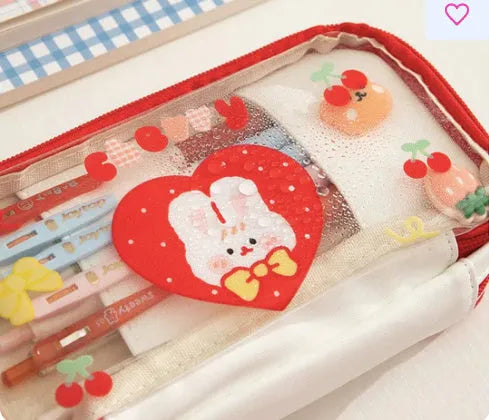 Japanese transparent heart pen bag with rabbit design showing pens inside