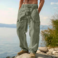Men's cotton loose wide-leg trousers in light army green, laid flat