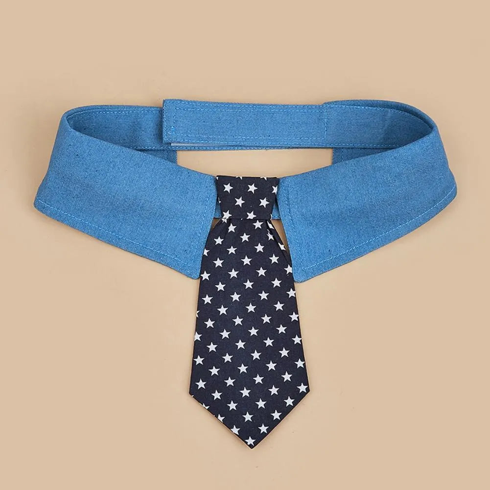 Denim dog collar with an attached red star pattern necktie, showing the adjustable fastener tape closure.