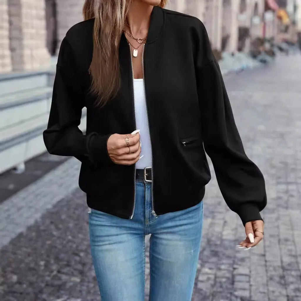 Black women's casual zip-up jacket with long sleeves and faux pockets on the front.