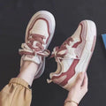 Pink and milky white low-top rubber sole sneakers with height increasing function
