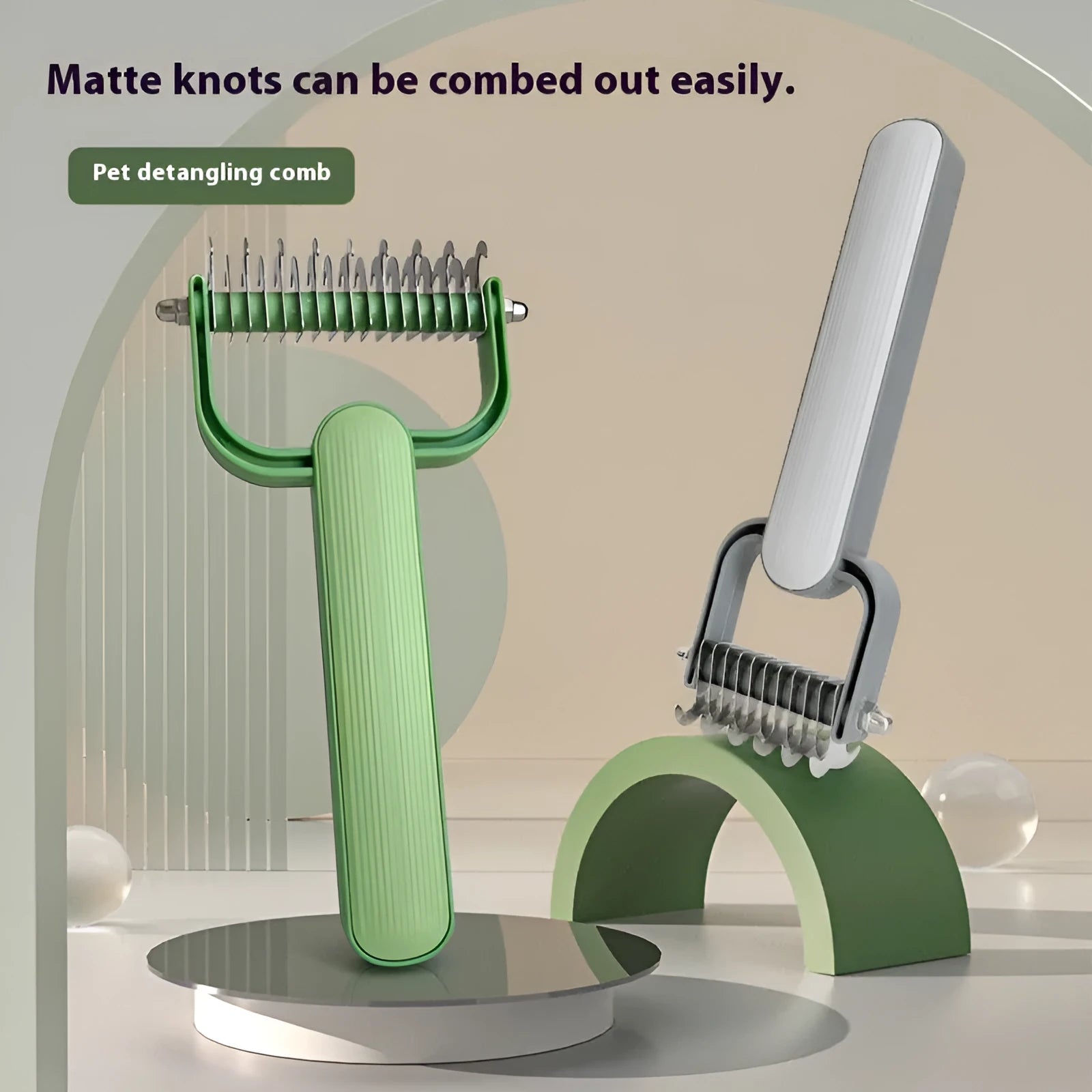 Green and grey dog unknotting comb with PP handle and stainless steel teeth, shown in large and small sizes.