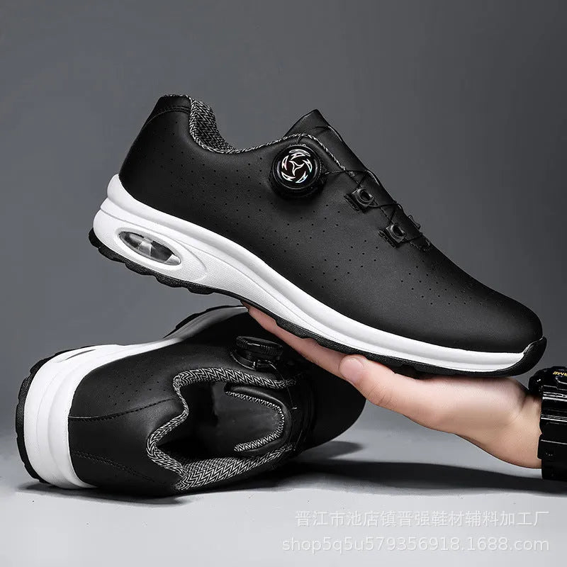 Black and white low top casual shoes with mesh upper, composite sole, and cross shoulder straps