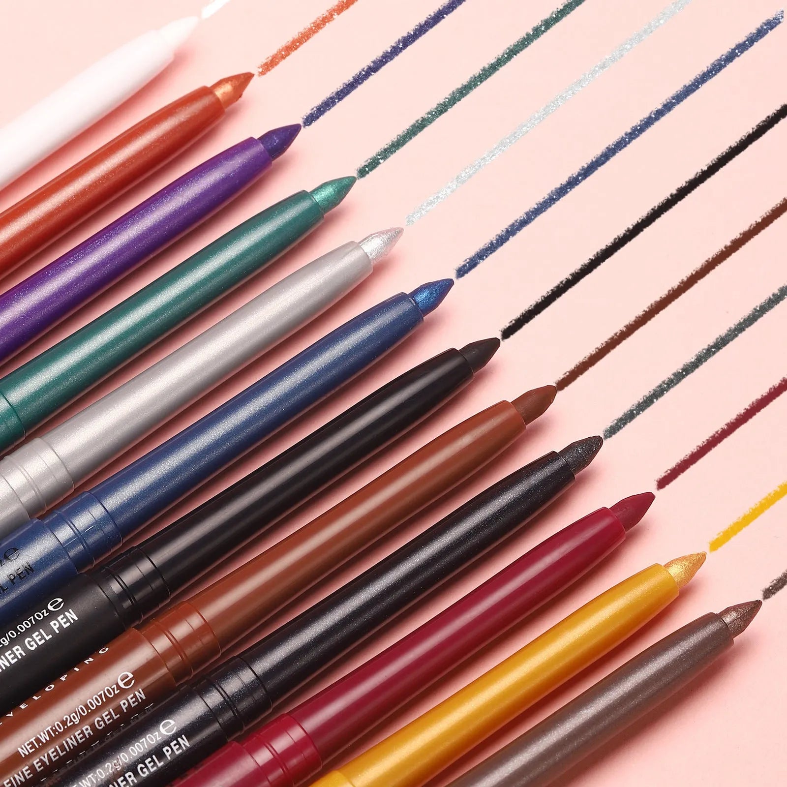 Set of 12 colourful gel eyeliner pencils with glitter, metallic, and matte tips displayed in a case.