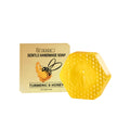 A 100g bar of turmeric and honey detoxification soap on a plain background.