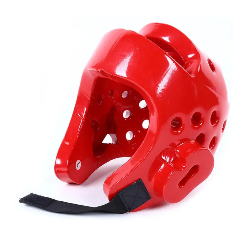 Karate protective gear set showing red helmet, boxing gloves and leg guard for martial arts training