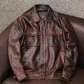 Men's black plus size PU leather jacket with lapel collar and side pockets on a hanger.