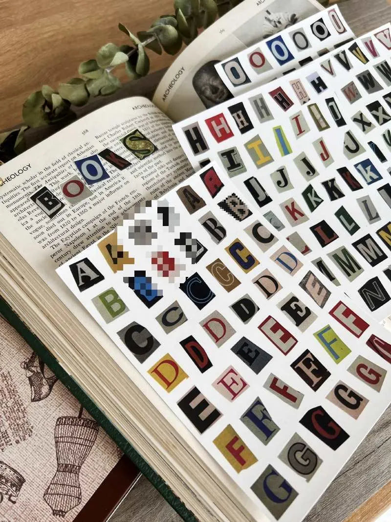 Set of cute style printed stickers showing English letters A, B, C, D, E and weekly words on a sheet.