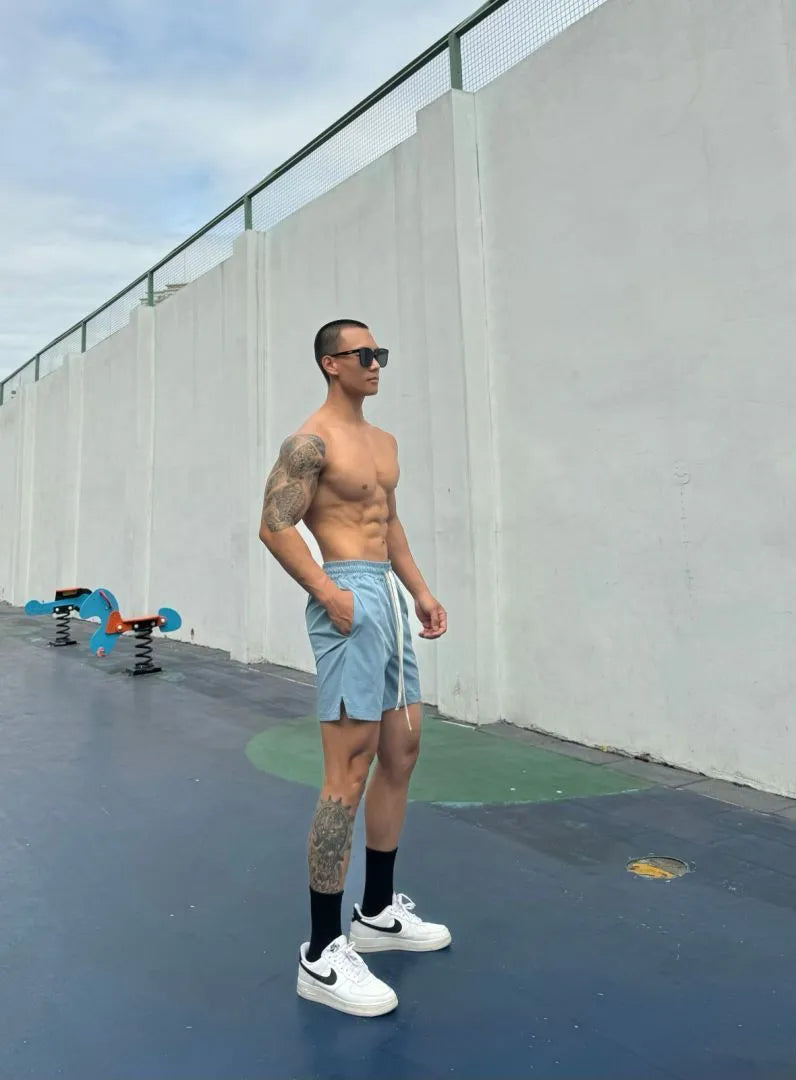 Men's quick-dry ice silk shorts in quarter-length design with double-layer construction