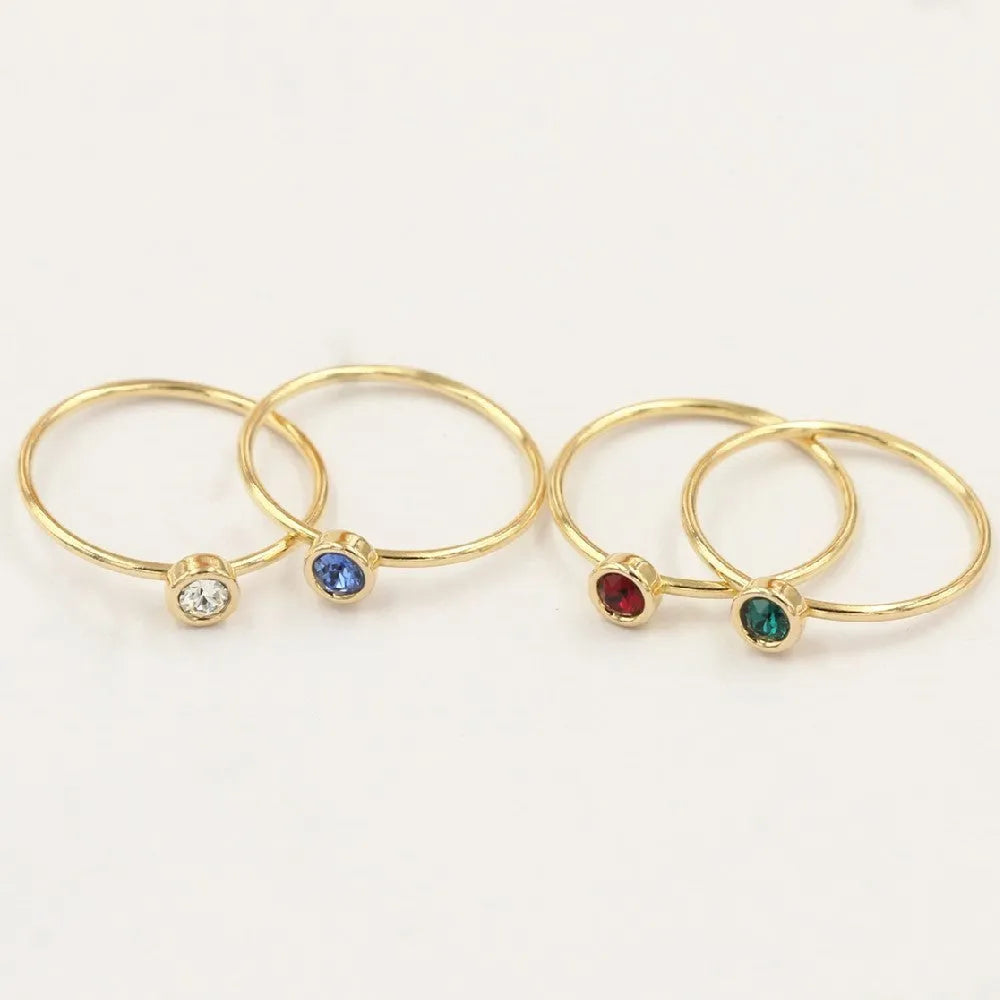 14K gilded GF zircon knuckle ring in green, blue, dark red, or white on a copper base.
