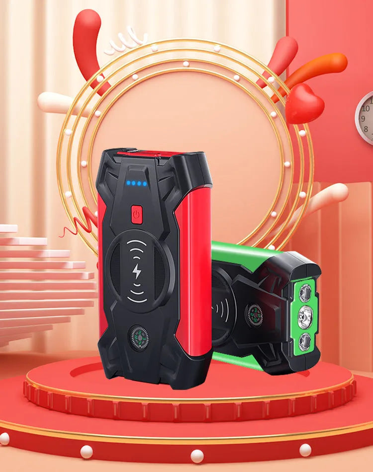 Red 12V portable car jump starter power bank with battery clips on a black background.