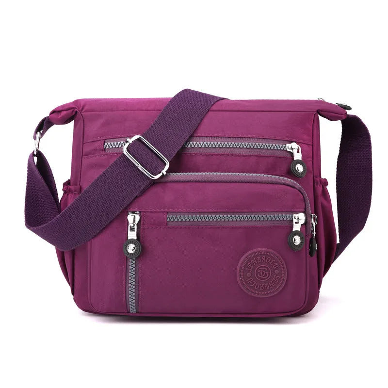 Nylon messenger bag with square vertical shape and single shoulder strap in available colours