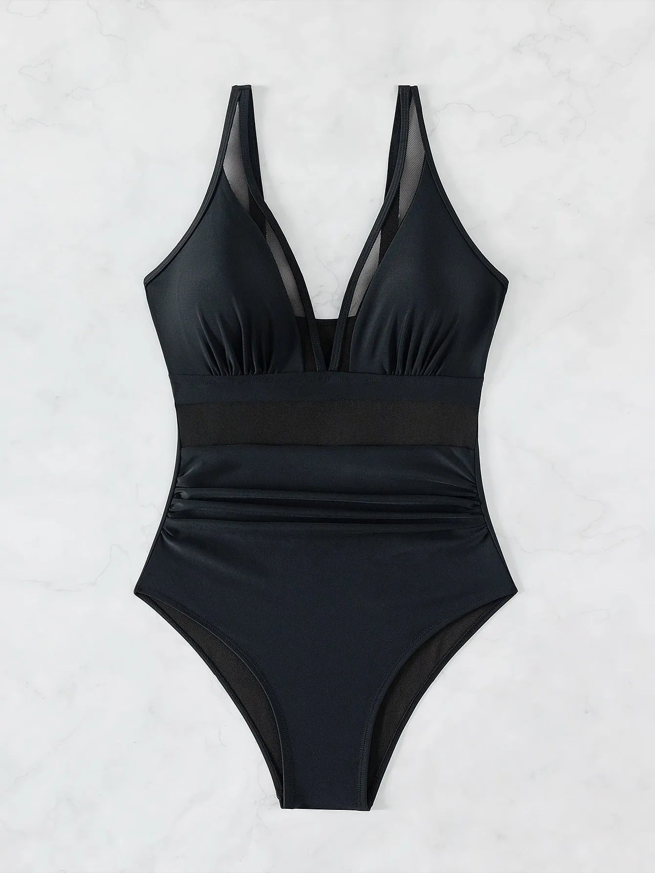 Black women's halter neck one-piece swimsuit with mesh panels on mannequin