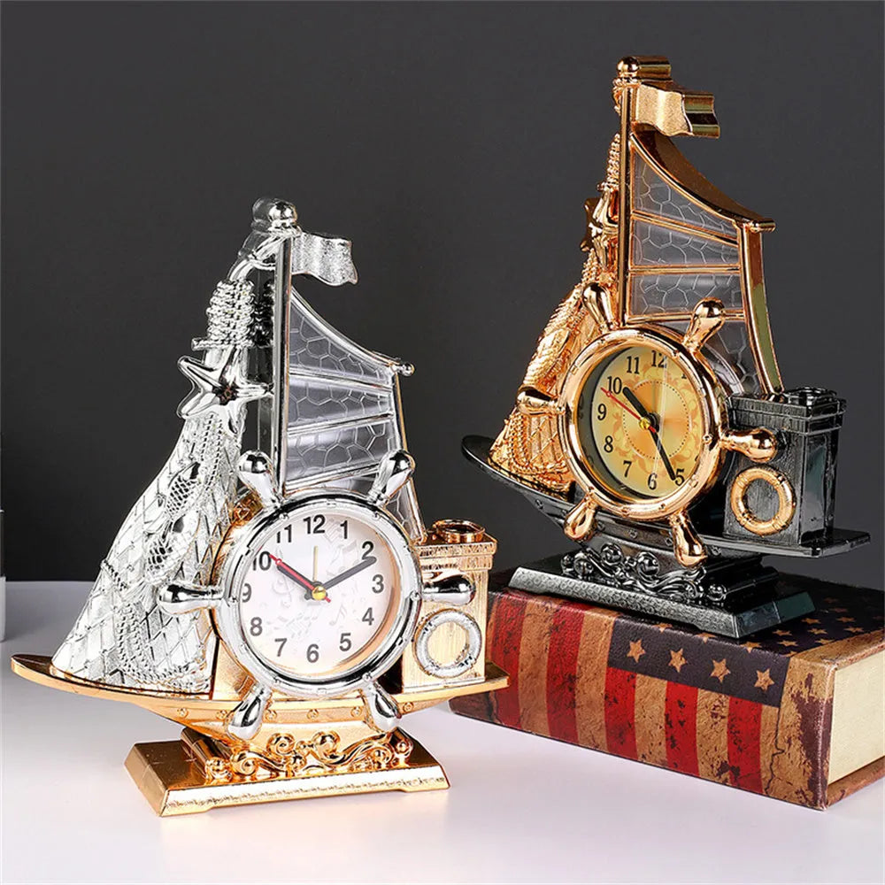 Fashion bedroom alarm clock in choice of gold or silver metallic finish on a surface.
