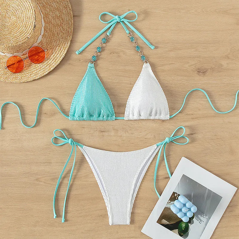 Women's colour matching two-piece swimsuit with lace-up front and pearl chain detail.