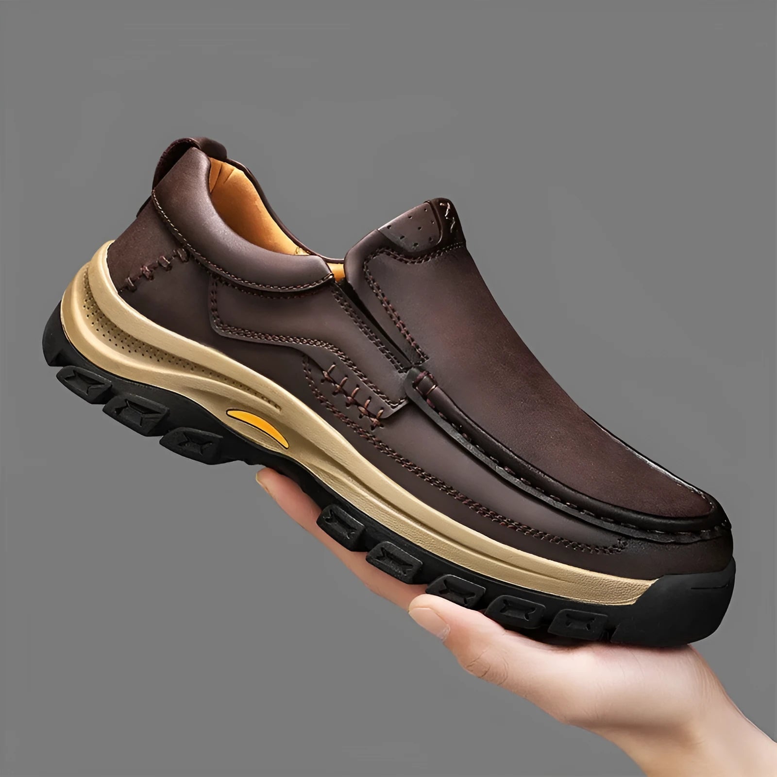 Men's black leather mountaineering shoes with thick rubber soles and round toe.