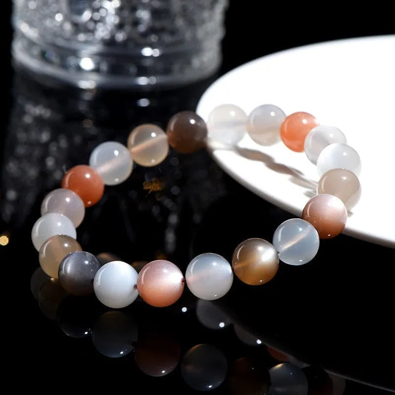 Natural moonstone bracelet with colourful pattern showing 8mm beads in single circle configuration