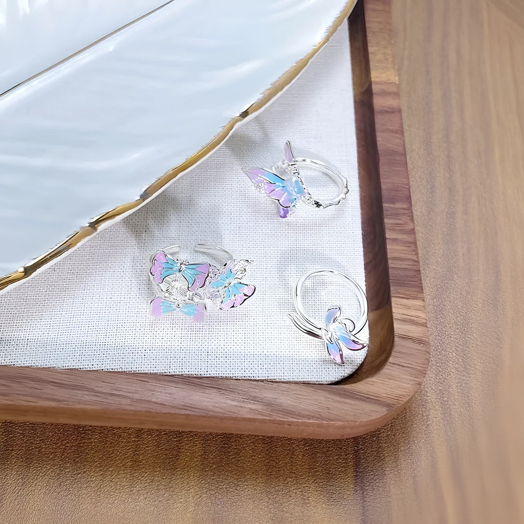 Adjustable copper insect ring with hand-dripped oil finish in silver, pink, or blue colour variations