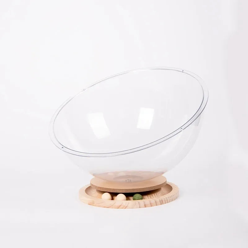 Transparent acrylic cat space capsule turntable with wooden base in cage setting