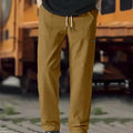Men's polyester trousers for spring and autumn in various colours including light grey and dark green.