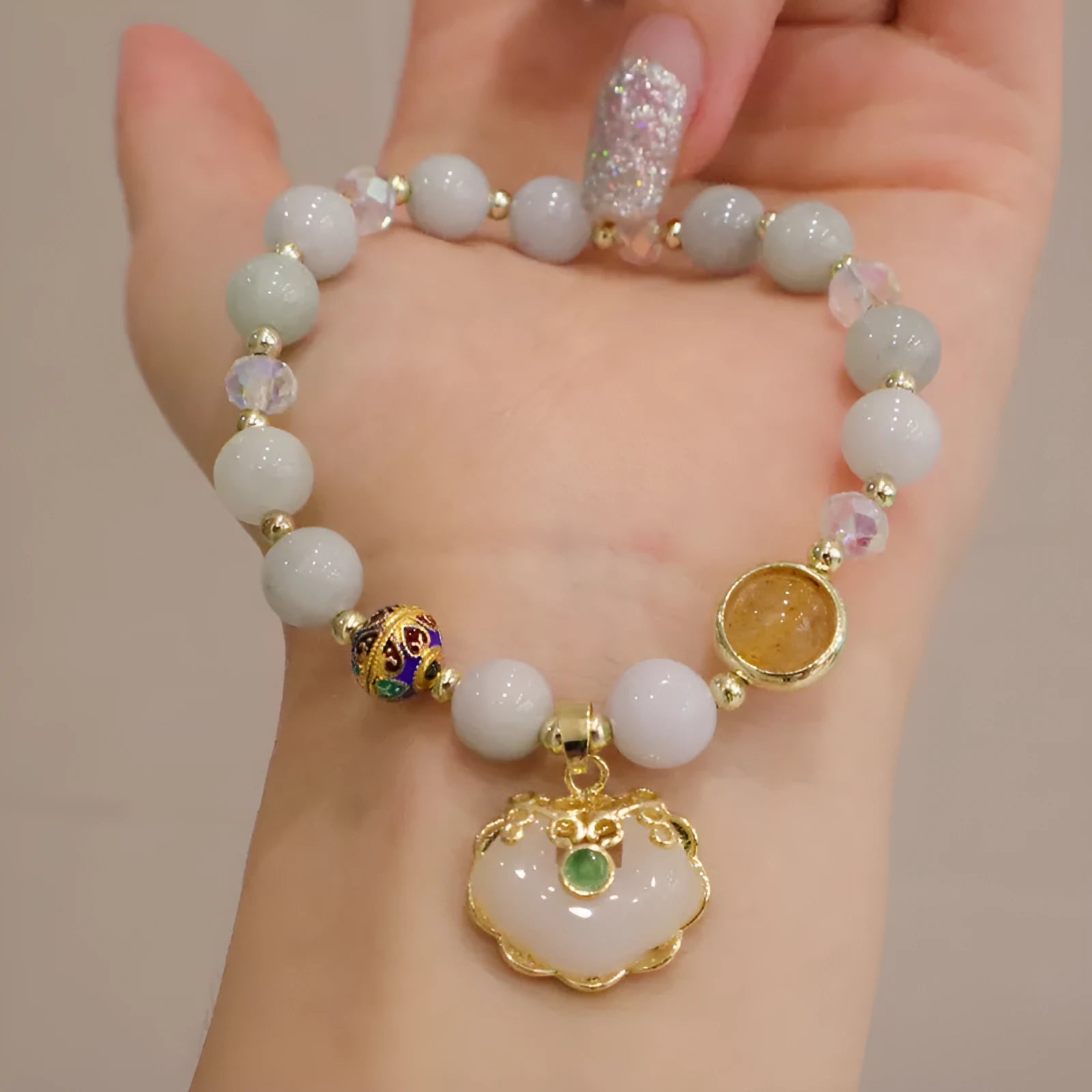 Gray jade and strawberry quartz women's bracelet with geometric ethnic metal decorations
