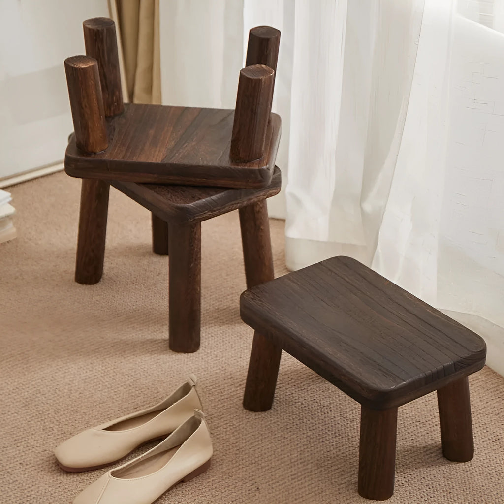 Distressed brown wooden stool with bracket legs for changing shoes