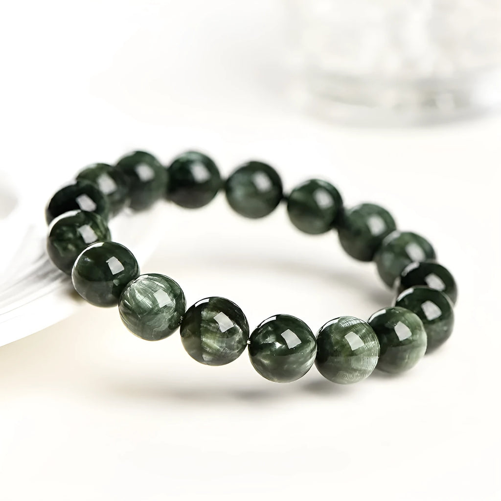 Natural green dragon crystal bracelet with 8-9mm round beads and geometric ruyi design.
