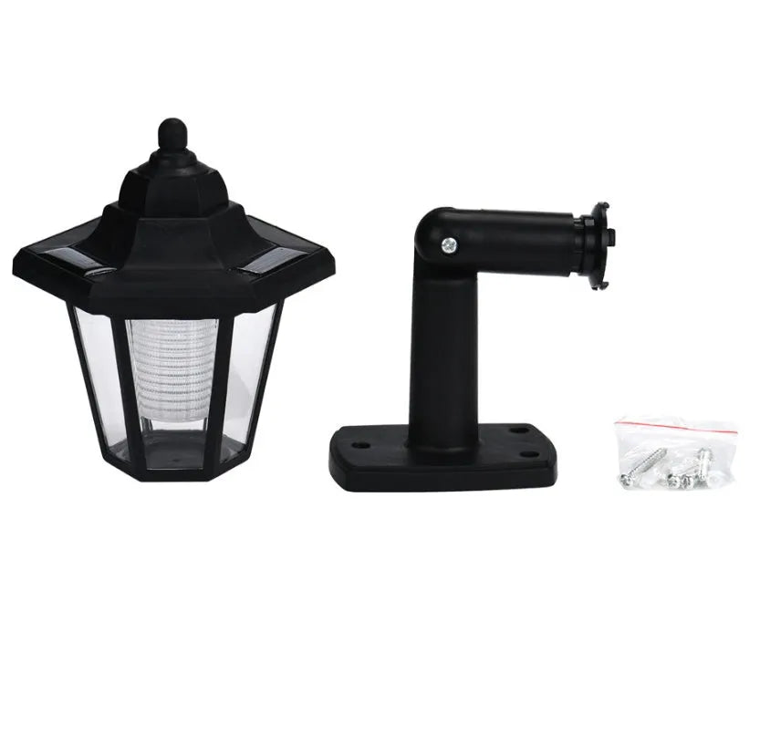 Black hexagonal solar wall light for outdoor use with automatic sensor and IP44 waterproof rating.