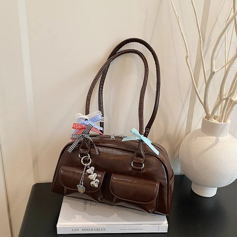 Retro PU leather pillow bag with one-shoulder design and double straps in black colour