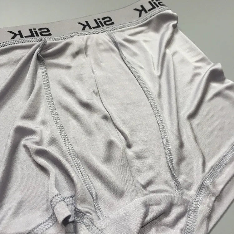 Men's loose-fit silk shorts in navy blue with mid-waist design