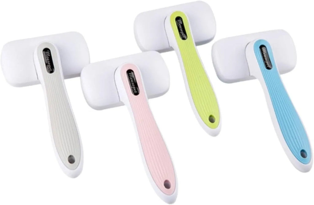 Blue automatic pet hair removal comb on a table, showing its size and one-click button.