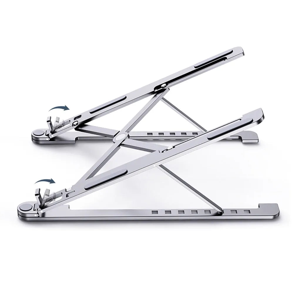 Aluminium foldable laptop stand in silver colour set to medium height with a laptop on top.