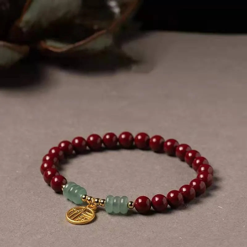 Wave-shaped bracelet with cinnabar segments and copper beads in national style design