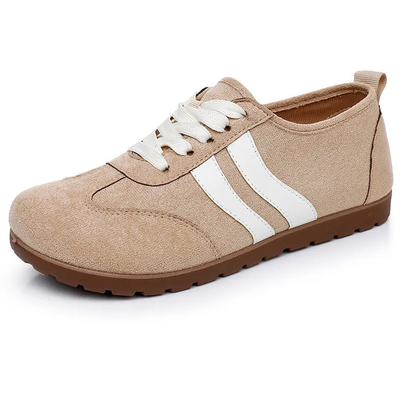 Women's dark red canvas sneakers with a flat rubber sole and round toe on a white background.