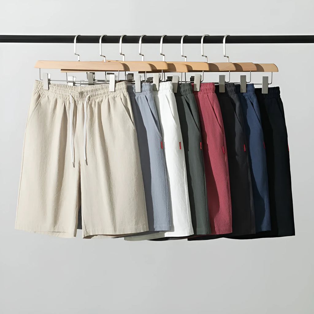 Solid colour cotton linen cropped pants with a drawstring waist on a hanger.