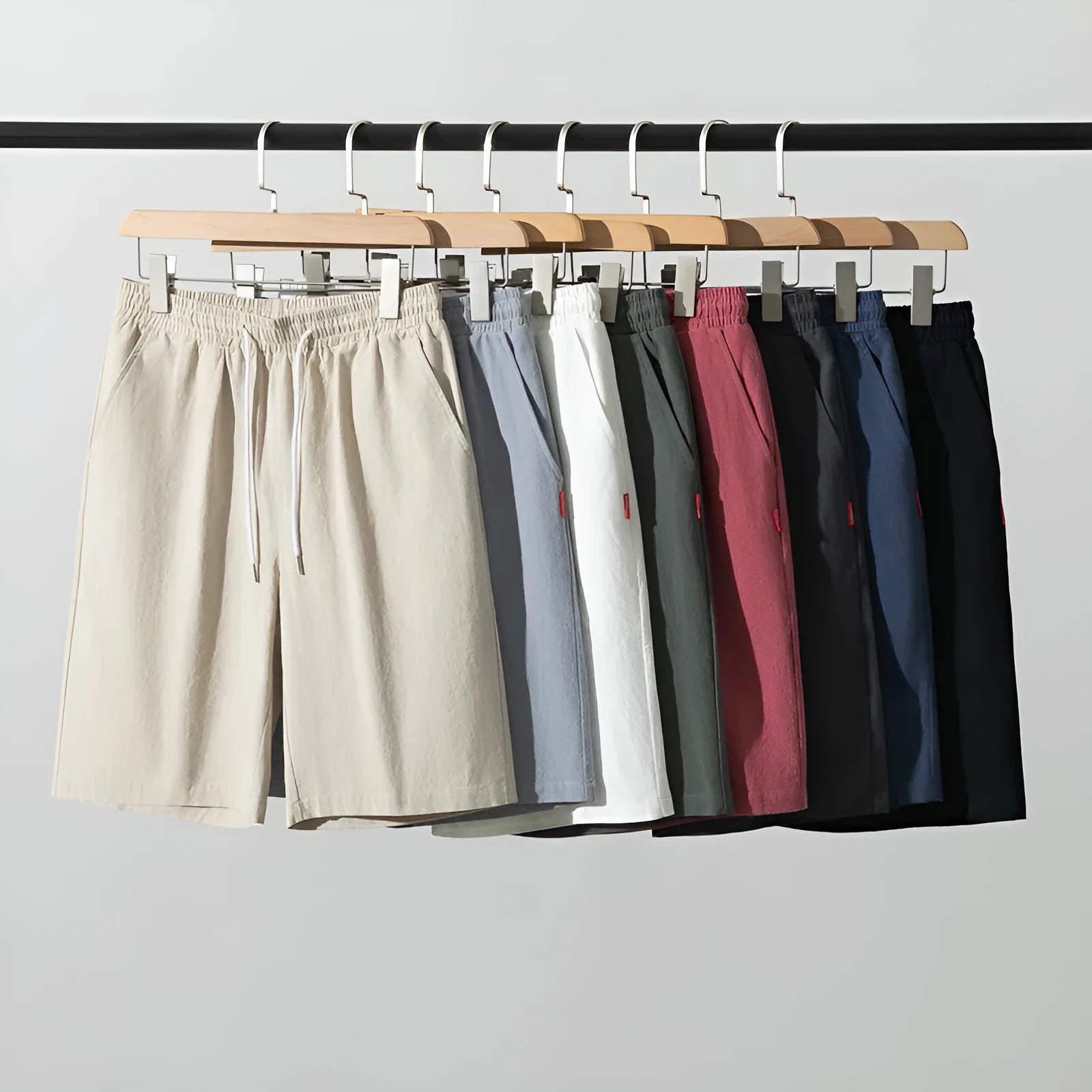 Solid colour cotton linen cropped pants with a drawstring waist on a hanger.