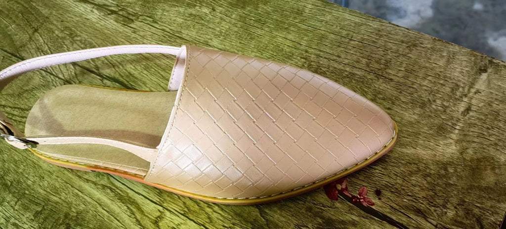 Pointed toe flat sandals with a buckle fastener on the upper, shown in a selection of colours.