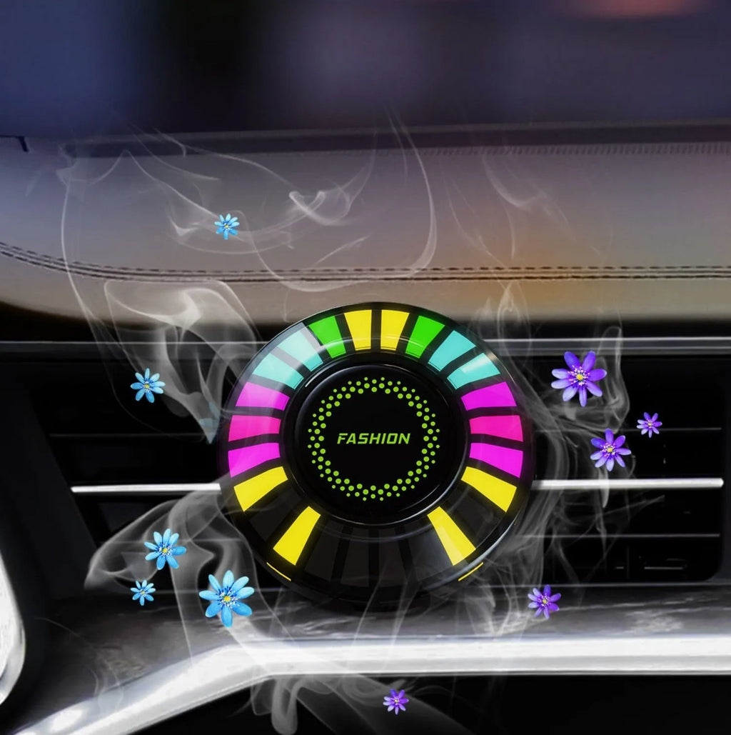3D RGB car atmosphere light mounted on a car air vent, showing voice control and aromatherapy functions.