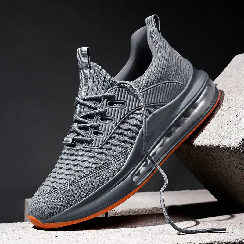 Men's black low-top lace-up running sneakers with mesh upper on a white background.