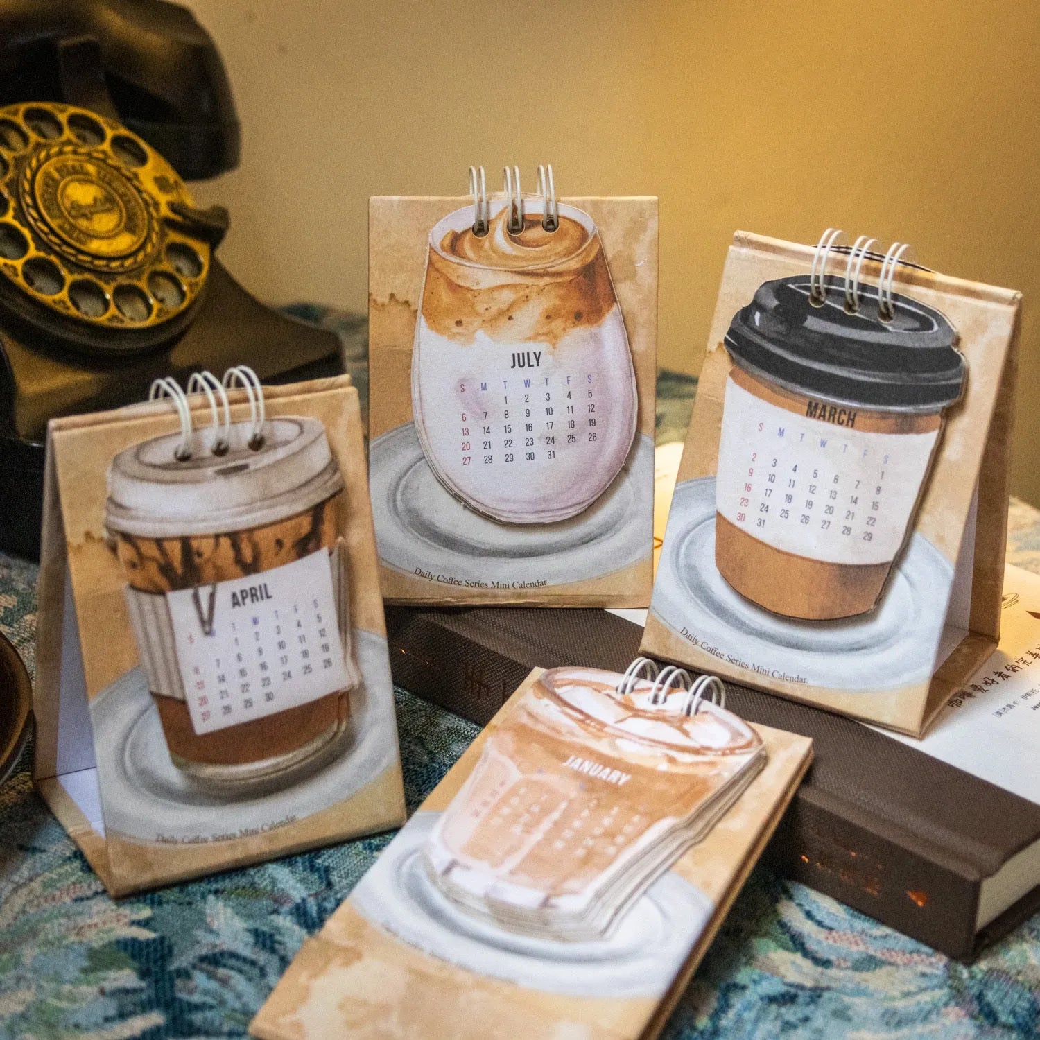 Coffee-themed mini desk calendar for 2025 with motivational designs for compact organisation