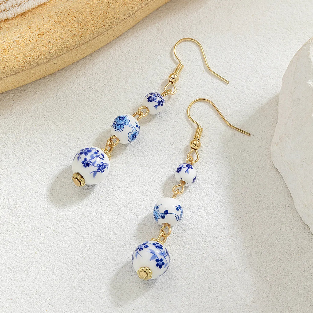Long blue and white porcelain ceramic bead retro earrings with geometric Chinese style design on alloy.