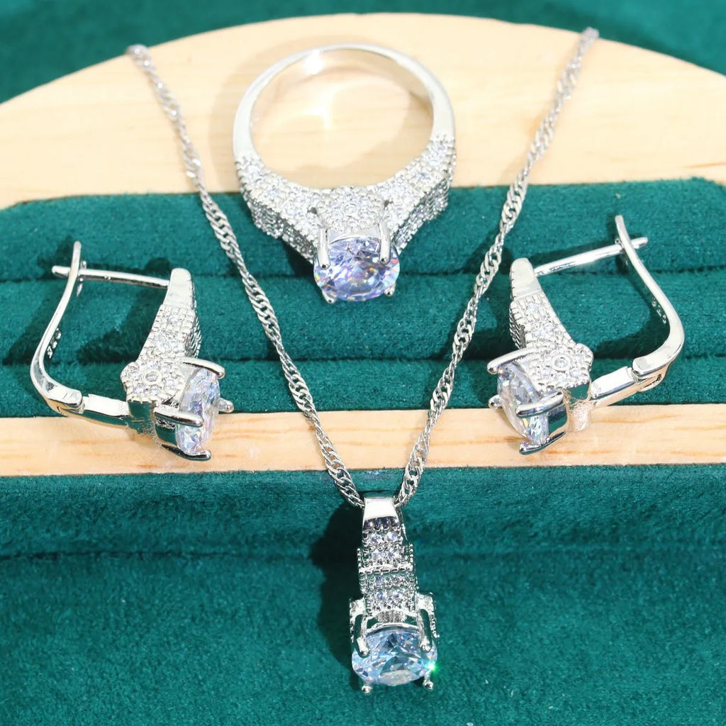 Four-piece bridal jewellery set with zircon alloy necklace, earrings, bracelet, and ring in water wave chain design