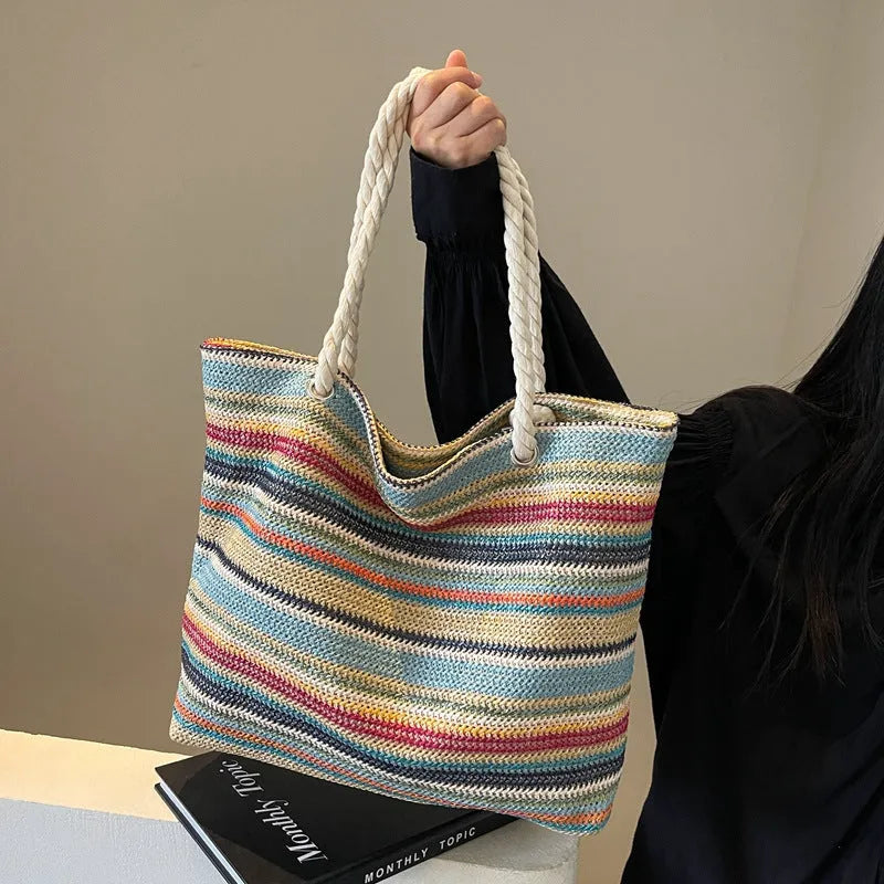 Blue woven nylon shoulder bag with large capacity and textured straw-like design