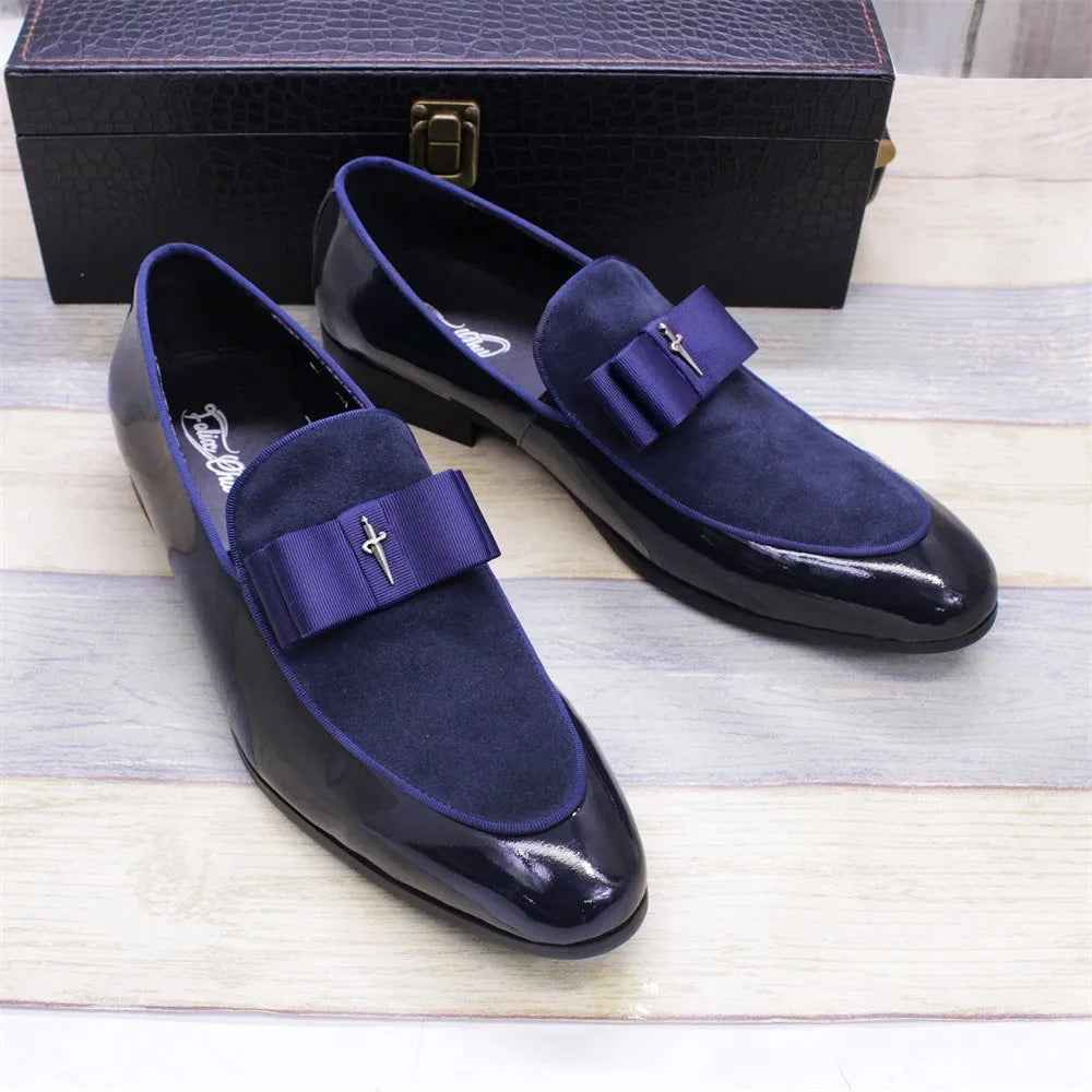 Men's low-top leather shoes in black with a tassel detail and glossy patent leather accents.