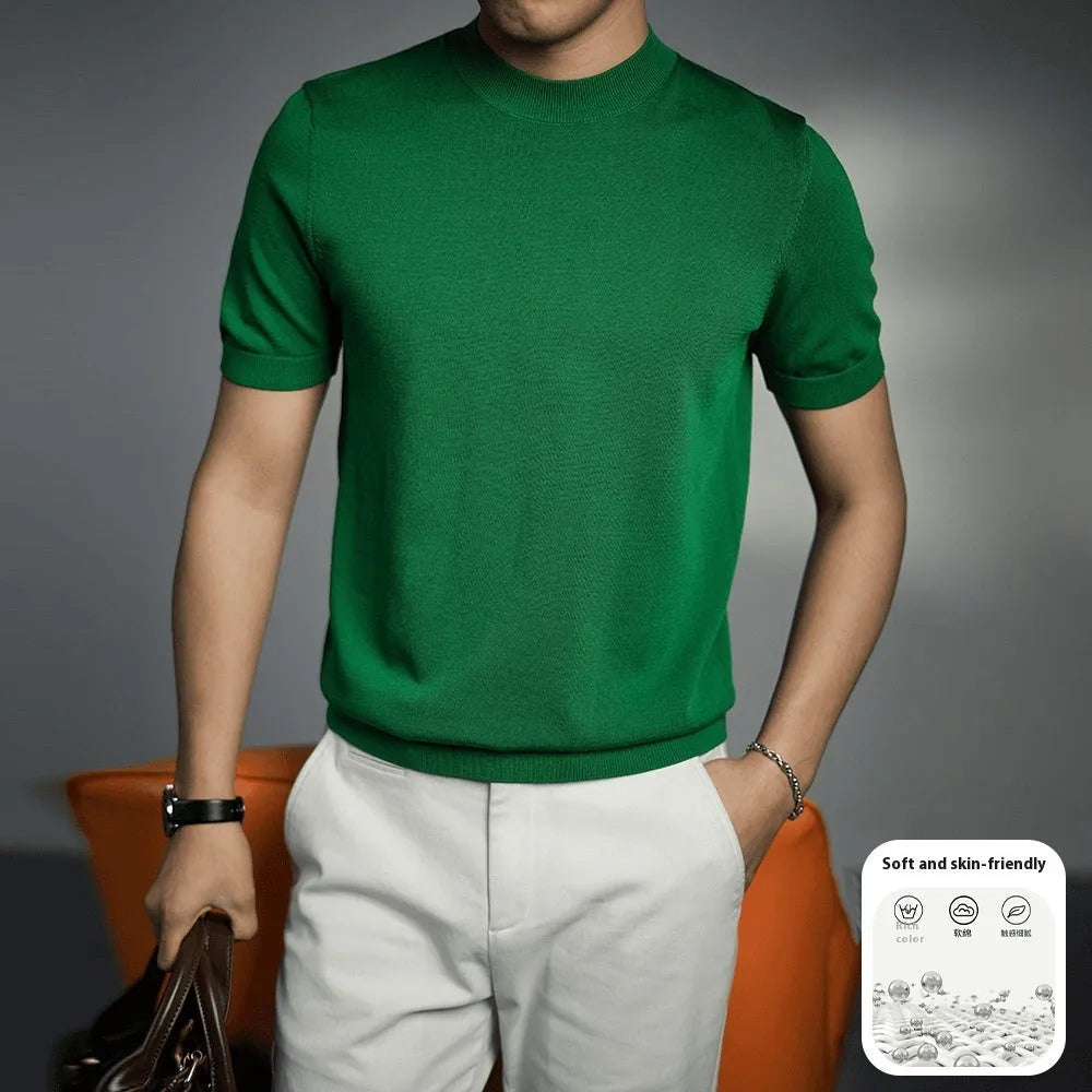 Man wearing a solid colour knitted t-shirt with round neck and short sleeves, showcasing business casual style.