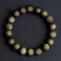 Obsidian meteorite crater ball bracelet with polished stones on adjustable string